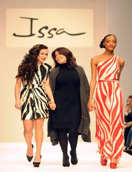 Designer Issa (C) and models walk down the catwalk at the Issa show, as part of London Fashion Week Autumn/Winter 2009 at the BFC tent, Natural History Museum on February 23, 2009 in London, England. (Photo by Stuart Wilson/Getty Images) *** Local Caption *** Issa