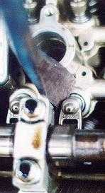 Crowbar prying out rocker arm