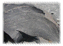 800px-Igneous_rock_Santoroni_Greece.jpg